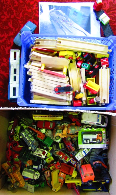 A box containing a quantity of various die cast model vehicles to include examples by Matchbox,