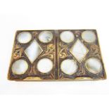 An unusual brass two divisional box with sliding covers with geometric mother-of-pearl inlaid panels