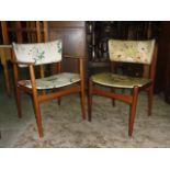 A set of six (four plus two) mid-20th century teak framed dining chairs with simply upholstered