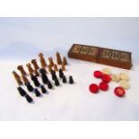 An antique turned timber chess set, 16 pieces in fruitwood, 13 in ebony together with a small