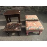 A pair of small foot stools with rectangular upholstered tops raised on painted supports with turned