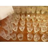 A large quantity of good quality clear cut drinking glasses to include numerous wines, tumblers,