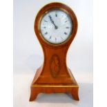 An Edwardian satinwood mantel clock with balloon shaped case, with ebony string inlay and conch