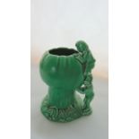 A Sylvac green glazed jug in the form of pixies climbing on a toadstool with impressed number to