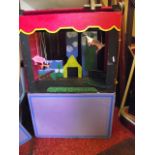 A home built wooden framed puppet theatre and accessories