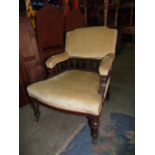 A Victorian walnut drawing room chair with upholstered seat and back, the show wood frame with