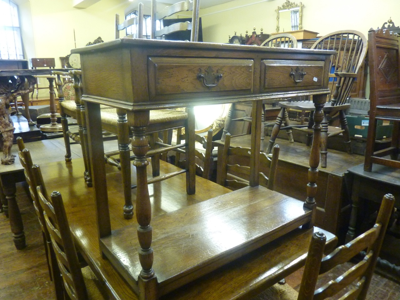 A good quality reproduction oak refectory table in the old English style, by Titchmarsh and Goodwin, - Image 3 of 6