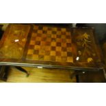 A 19th century continental fold-over-top games table of rectangular form with rounded corners and