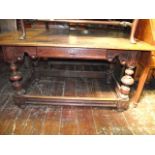 An antique oak centre table of continental origin, the rectangular top with moulded outline over a