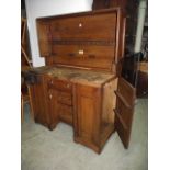 A vintage oak framed carpenters work bench by Melhuish and Sons Tool Makers, Fetter Lane London, the