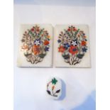 Two marble panels inlaid with multi coloured stone floral sprays together with a similar box and