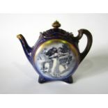 An unusual Doulton Burslem blue ground teapot, of two sided form with printed Shakespearean