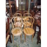A set of six light beechwood Bentwood café chairs with circular panelled seats
