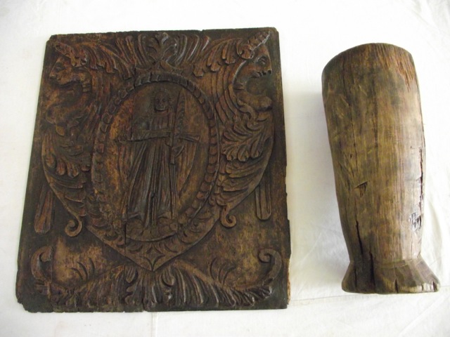 A reclaimed antique oak panel of rectangular form with carved central oval medallion with Saint ?