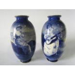 A pair of large early 20th century Royal Doulton blue and white printed vases, one showing a coastal