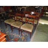 A set of six Georgian mahogany spade back dining chairs with inlaid detail, upholstered seats and