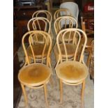 A set of six light beechwood Bentwood café chairs with circular seats
