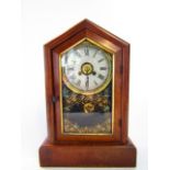 An American cottage mantel clock with pitched case, eight day striking movement with alarm action