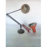 An Anglepoise desk lamp by Herbert Terry with all over blackened finish together with a further