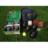 A set of four contemporary Henselite lawn bowls in original cardboard packaging together with a