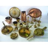 A collection of metal wares to include a copper ewer with turned timber handle, a copper tray of