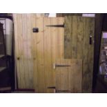 Four reclaimed ledged and braced internal tongue and groove panelled doors of varying size, three in