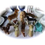 A collection of ceramic animals including a Sylvac buff glazed model of a doleful dog with impressed