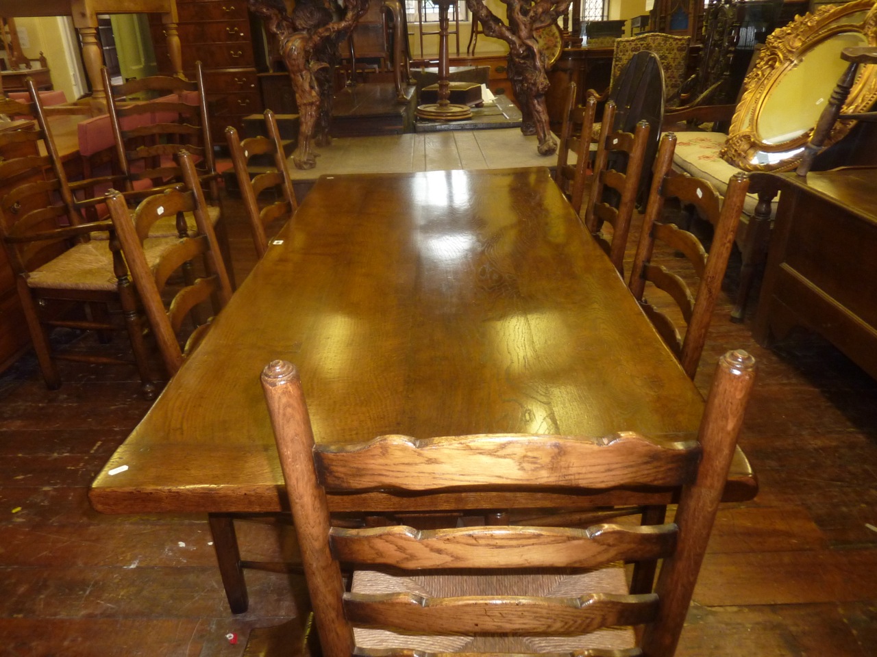 A good quality reproduction oak refectory table in the old English style, by Titchmarsh and Goodwin,