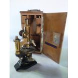 A good quality scientific microscope stamped E Leitz Wetzlar, No 54956, principally in brass with