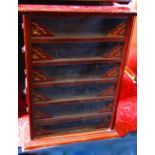 An early 20th century six tier glazed fronted shop display cabinet, principally in mahogany, of