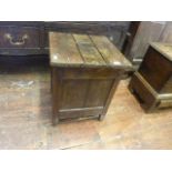 A country made old English style mixed wood box stool with panelled frame, the top with central