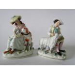 A pair of 19th century Staffordshire figure groups, one of a seated female character feeding a large