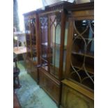 A good quality Georgian style upright mahogany bookcase, the lower section enclosed by two