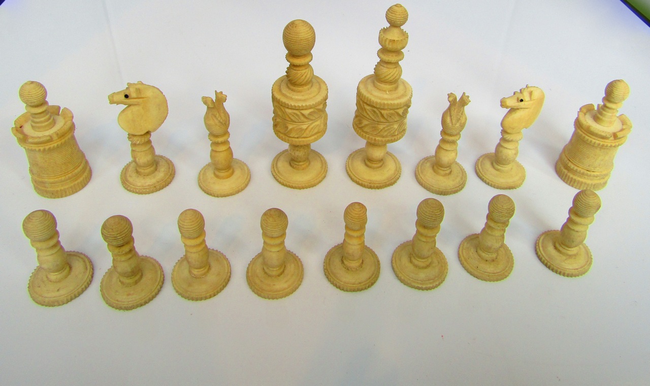 A complete antique eastern ivory chess set all with hand carved and turned pieces, half stained red, - Image 3 of 3