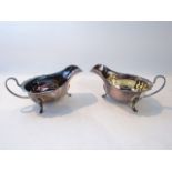 A pair of silver sauce boats, Viner's Ltd, Sheffield, probably 1938 - 1939, each boat-shaped body on