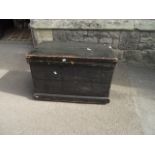 A 19th century stained pine box with hinged lid and ironwork carrying handles