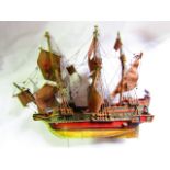 A highly detailed model of a three masted Elizabethan galleon, the sails detailed with ER and red