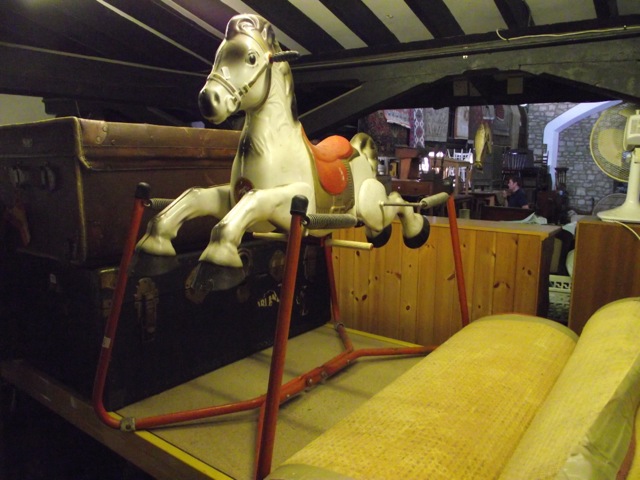 A vintage Mobo Prairie King child's toy rocking horse with painted tubular steel frame