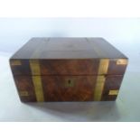 A Victorian mahogany veneered writing box with brass banded exterior, with further vacant brass