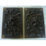 A pair of antique oak panels of rectangular form with well carved matching detail in the form of a
