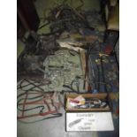 A quantity of vintage equine tack, stitched leather nose bags, a selection of whips, two with carved