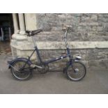 A vintage Raleigh ladies bicycle with tubular steel frame, leather Brooks saddle and bag carrying