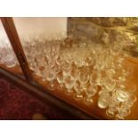 An extensive collection of clear cut drinking glasses to include wines with fan cut detail, large