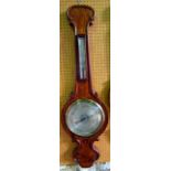 A substantial mid Victorian wheel barometer with figured mahogany case and applied moulded detail