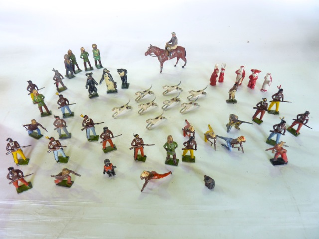 A collection of antique painted lead farmyard models, mostly by Britains to include numerous horses,