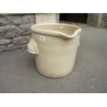 A vintage cream glazed stoneware pail of circular form with pouring lip, pronounced moulded cup