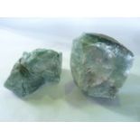 Two large sections of pale blue mineral rock of crystallite composition