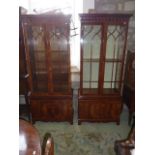 A good quality Georgian style upright mahogany bookcase, the lower section enclosed by two