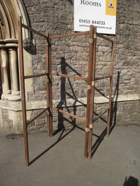 A large stripped pine framed floor standing three fold vintage clothes airer