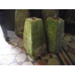 Two small weathered natural stone staddle stone bases of square tapered form